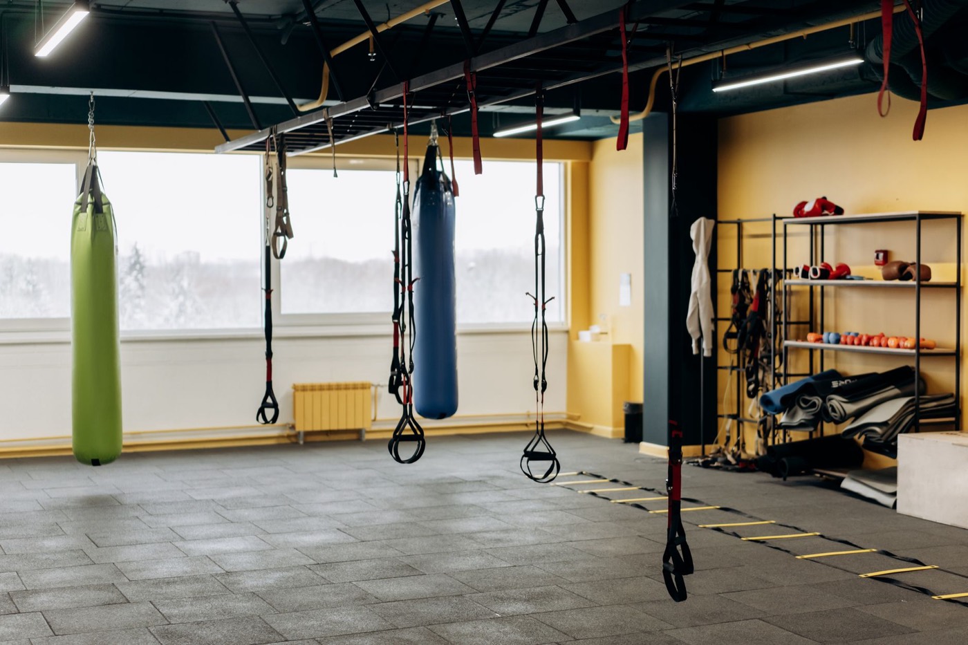 Modern gym floor with rigs and equipment